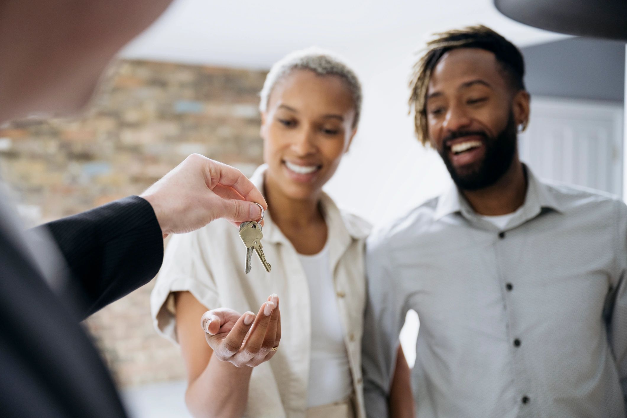 Homeowners receiving keys to their new home
