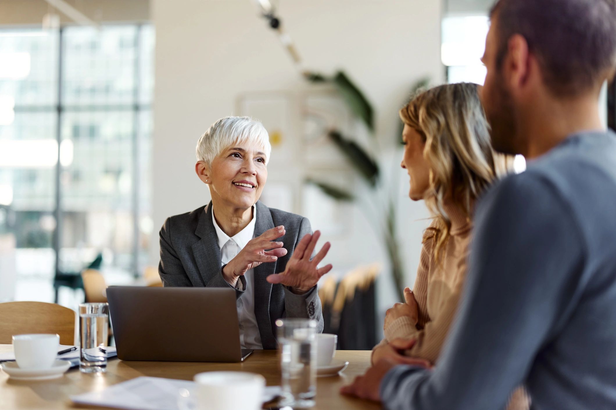 Home buyers meeting with a real estate agent to plan their move