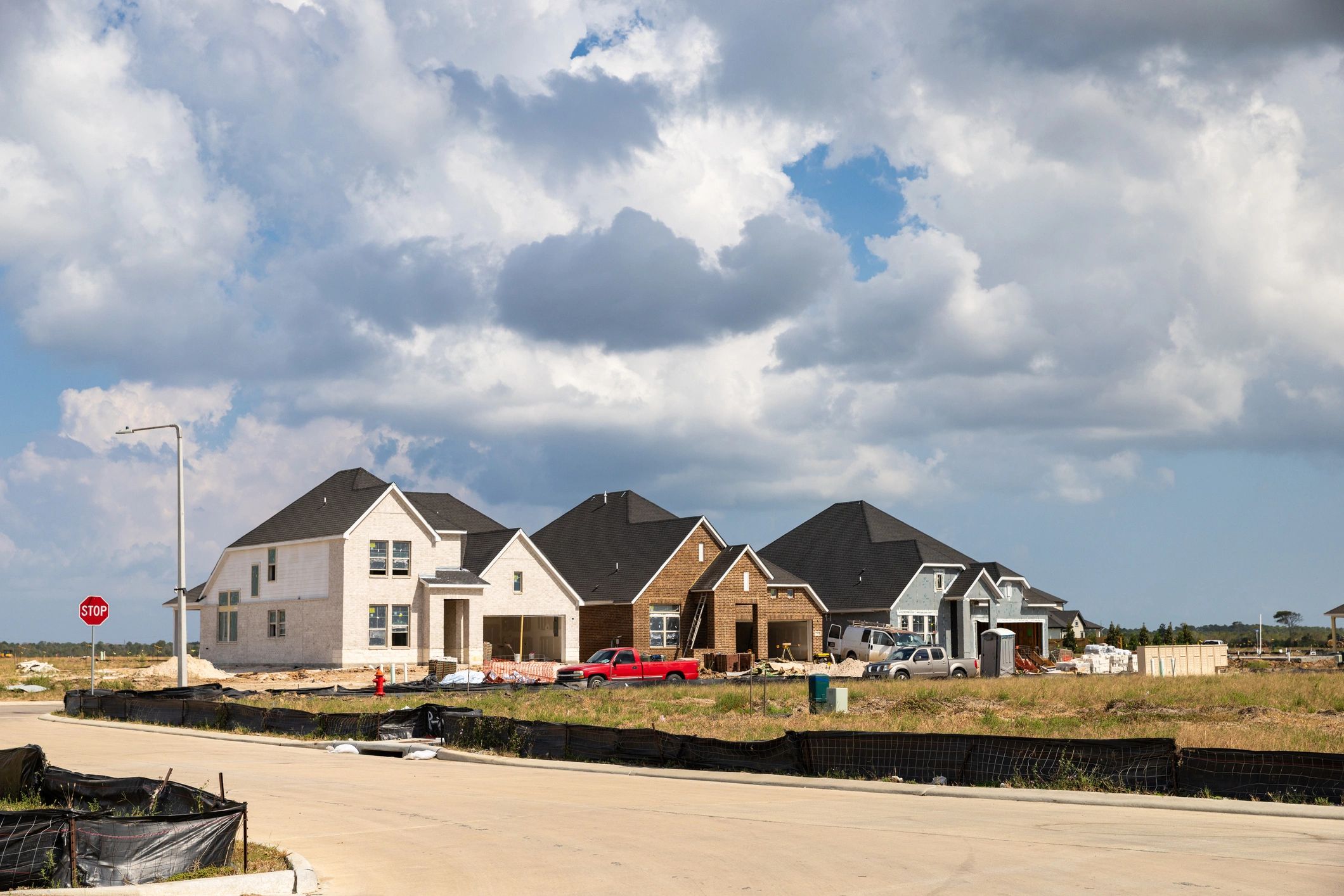 Suburban neighborhood street with new homes under construction